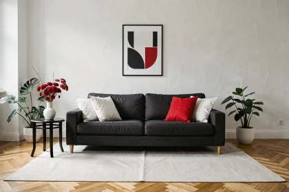 Salon moderne parisien décoré avec la palette rouge blanc noir pour une ambiance élégante et équilibrée